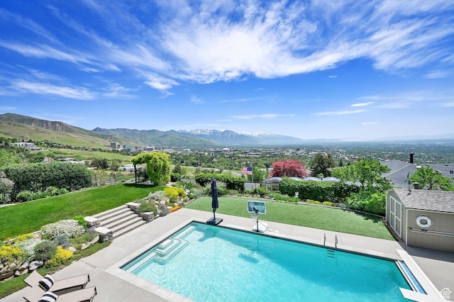 1274 E Chandler, Salt Lake City, UT 84103 - swimming pool featuring a mountain view, an outbuilding, and a storage unit