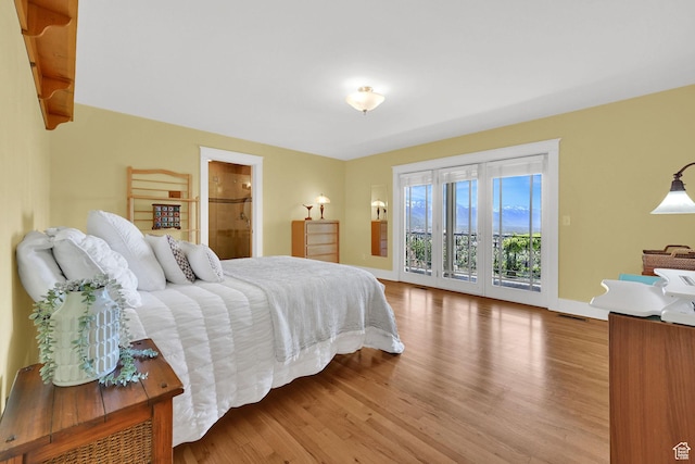 1274 E Chandler, Salt Lake City, UT 84103 - bedroom with access to exterior, wood finished floors, and baseboards
