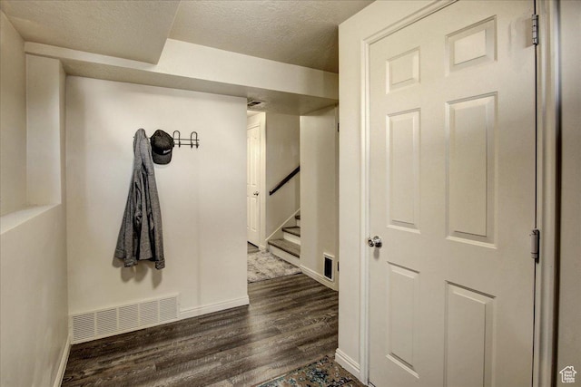 5812 Club View Ln, South Ogden, UT 84405 - hall featuring dark wood-style flooring, stairs, baseboards, and a textured ceiling