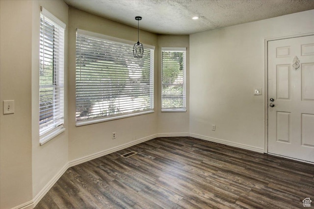 5812 Club View Ln, South Ogden, UT 84405 - unfurnished dining area with plenty of natural light, dark wood-style flooring, baseboards, a textured ceiling, and recessed lighting