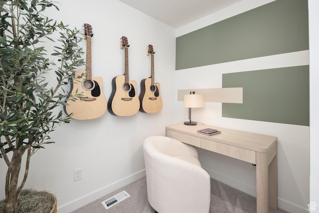 carpeted home office with baseboards