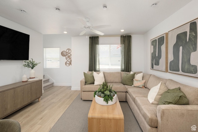 living room featuring light wood-style floors, recessed lighting, baseboards, and ceiling fan