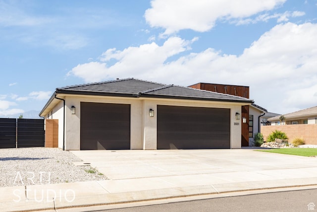3551 E 3050th St S, St George, UT 84790 - view of front facade featuring driveway, a garage, and stucco siding