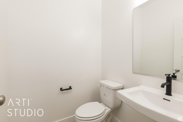 3551 E 3050th St S, St George, UT 84790 - bathroom with a sink, toilet, and baseboards