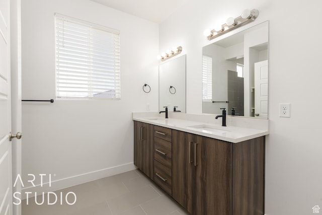 3551 E 3050th St S, St George, UT 84790 - bathroom with plenty of natural light, double vanity, tile patterned floors, and baseboards