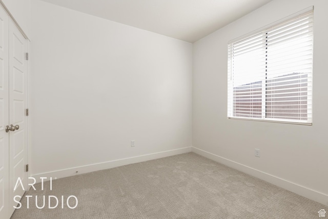 3551 E 3050th St S, St George, UT 84790 - spare room with light colored carpet, baseboards, and healthy amount of natural light