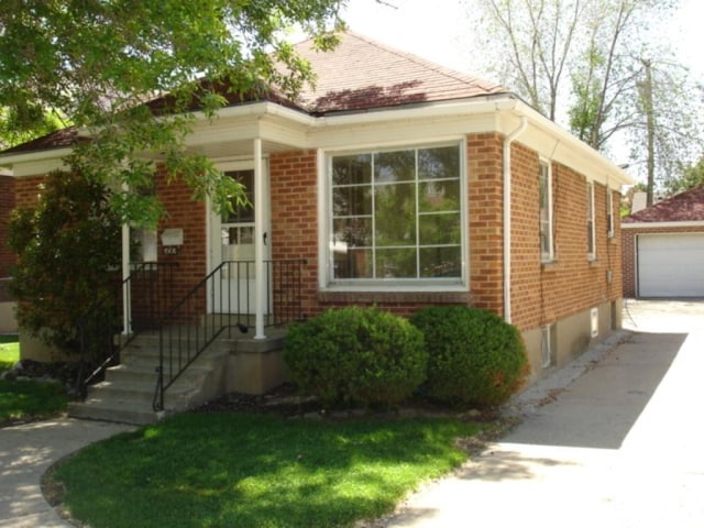ranch-style house featuring brick siding