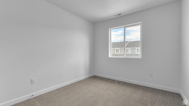 116 N Seaside St Unit 2317, Saratoga Springs, UT 84045 - carpeted empty room featuring baseboards and a textured ceiling