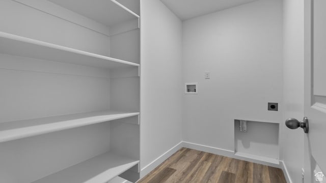 116 N Seaside St Unit 2317, Saratoga Springs, UT 84045 - laundry area with electric dryer hookup, washer hookup, wood finished floors, and baseboards