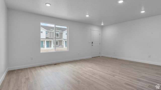 116 N Seaside St Unit 2317, Saratoga Springs, UT 84045 - unfurnished room featuring light wood-type flooring, baseboards, and recessed lighting