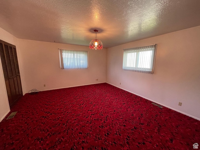 15 E Main, Wellsville, UT 84339 - unfurnished bedroom with carpet and a textured ceiling