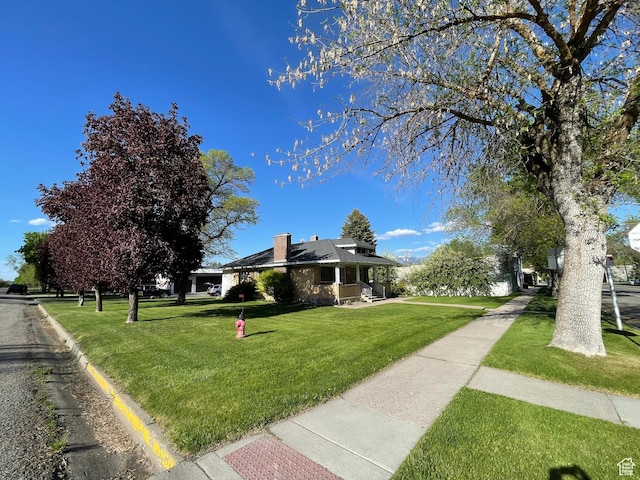 15 E Main, Wellsville, UT 84339 - view of front of property featuring a front lawn and a chimney