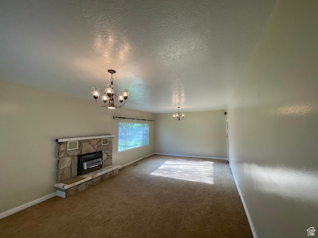 15 E Main, Wellsville, UT 84339 - unfurnished living room with a chandelier, carpet, baseboards, a fireplace, and a textured ceiling
