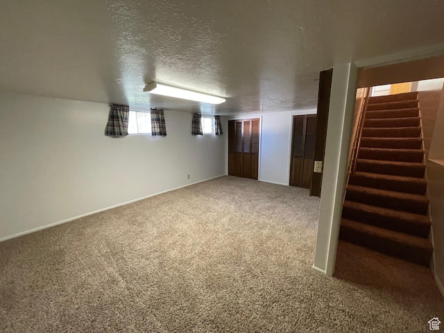 15 E Main, Wellsville, UT 84339 - spare room featuring stairs, carpet floors, baseboards, and a textured ceiling