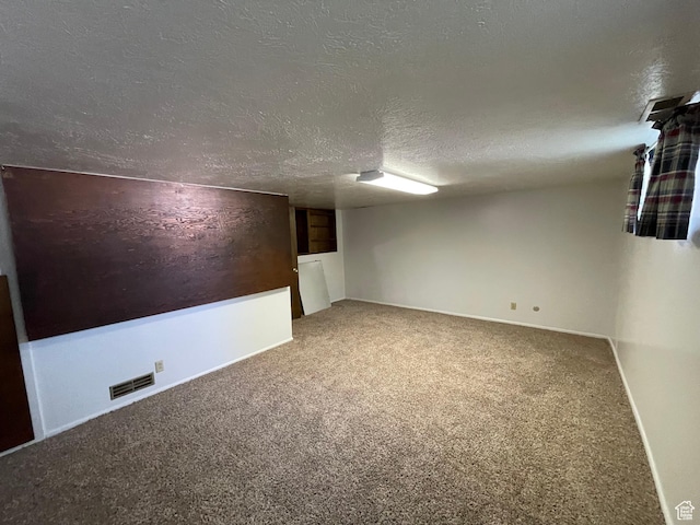 15 E Main, Wellsville, UT 84339 - carpeted spare room with a textured ceiling