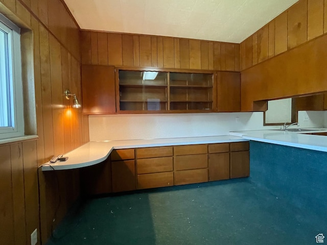 15 E Main, Wellsville, UT 84339 - kitchen with wooden walls, light countertops, a sink, brown cabinets, and open shelves