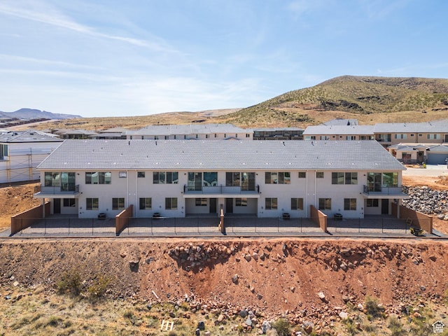 view of subject property featuring a mountain backdrop