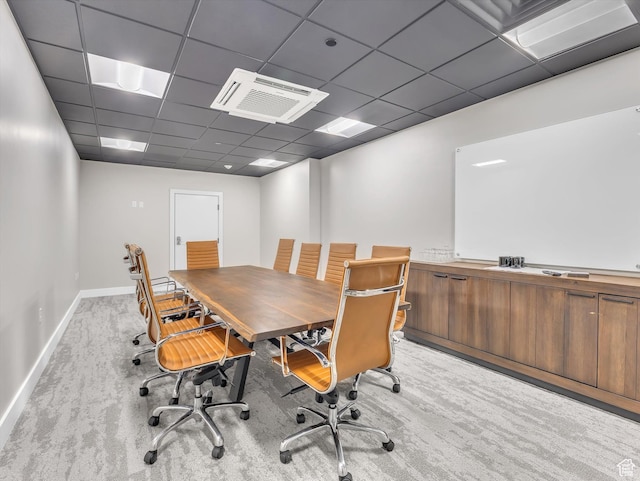 office area featuring a drop ceiling and baseboards