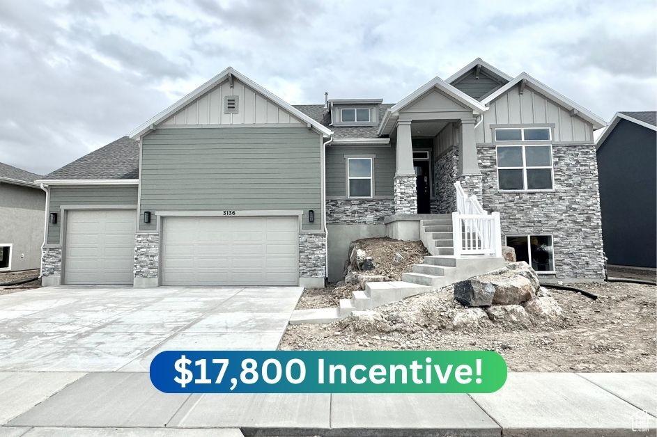 3136 N 2875 W Unit 28, Plain City, UT 84404 - craftsman-style house with stone siding, board and batten siding, driveway, and a garage