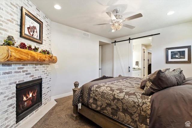 3416 W Spring Cir, Mountain Green, UT 84050 - bedroom with a barn door, carpet floors, a fireplace, a ceiling fan, and recessed lighting