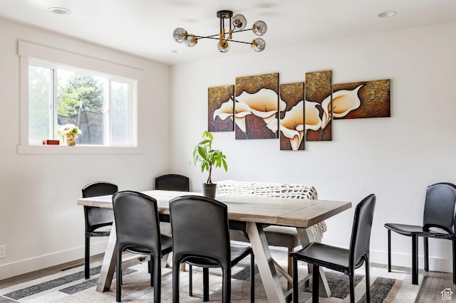 dining room featuring baseboards, a chandelier, wood finished floors, and recessed lighting