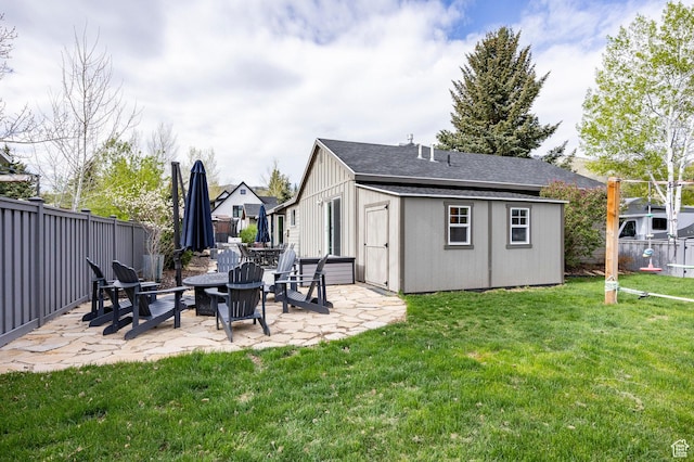 view of outbuilding featuring an outdoor fire pit and an outbuilding
