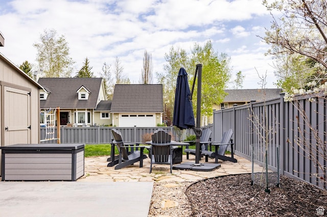 view of patio with a fire pit and a fenced backyard