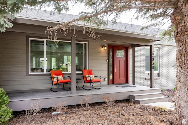 property entrance featuring brick siding