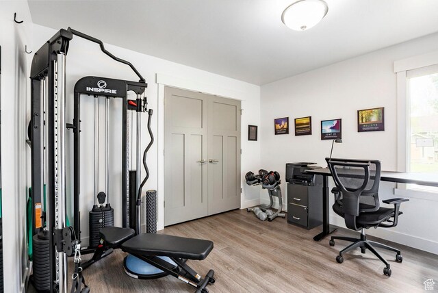 home office featuring wood finished floors and baseboards
