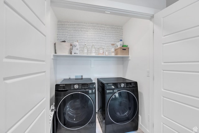 washroom with independent washer and dryer