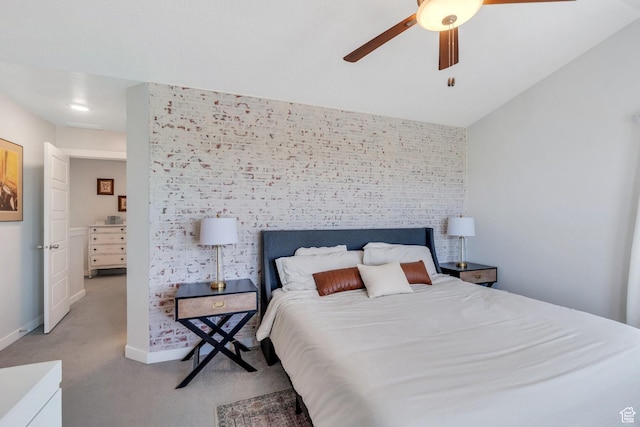 bedroom with light carpet, baseboards, and a ceiling fan