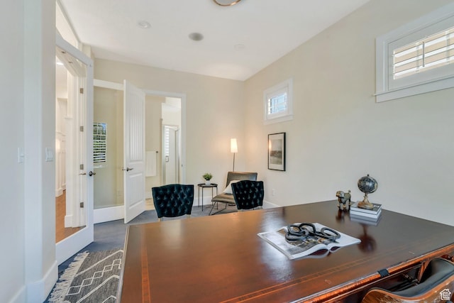 office area featuring baseboards and dark wood-style floors