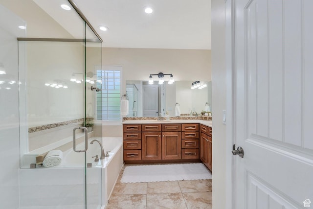 full bathroom with a stall shower, a bath, double vanity, and tile patterned flooring