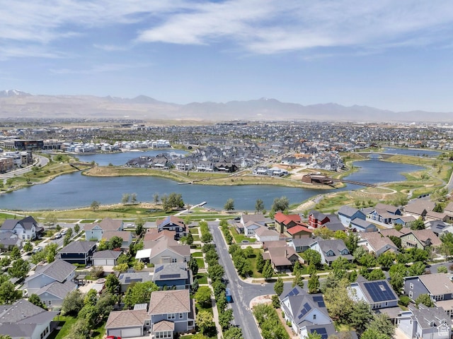 view of property location with nearby suburban area and a water and mountain view
