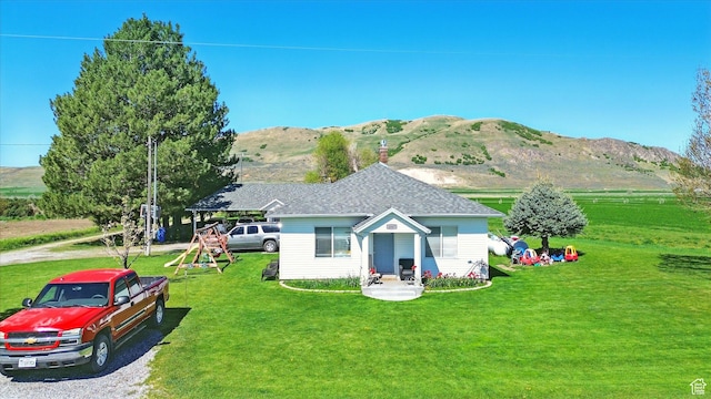 1317 S 400 E, Trenton, UT 84338 - rear view of property with a mountain view and a lawn
