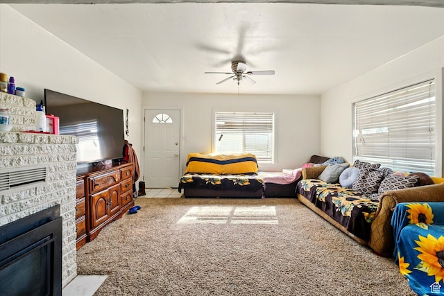 1317 S 400 E, Trenton, UT 84338 - carpeted living area featuring ceiling fan and a glass covered fireplace