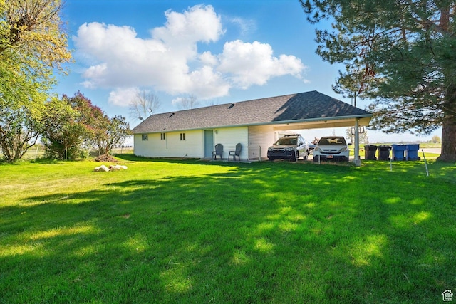 1317 S 400 E, Trenton, UT 84338 - rear view of house featuring a lawn and an attached carport