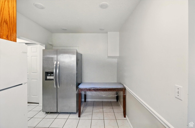 1317 S 400 E, Trenton, UT 84338 - kitchen with stainless steel fridge, freestanding refrigerator, and light tile patterned floors