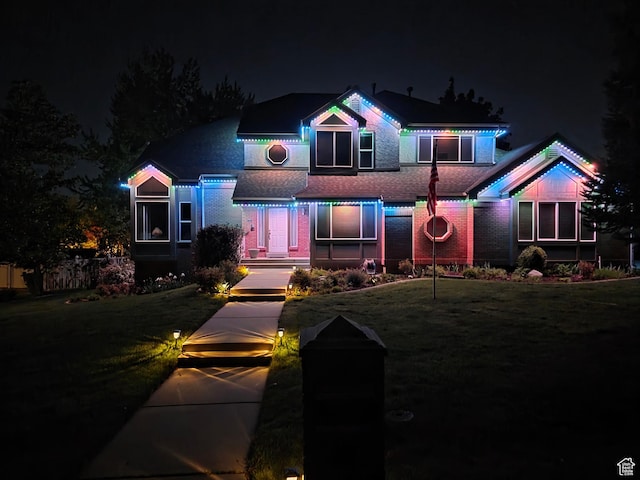 22 Snowstar Ln, Sandy, UT 84092 - view of front of house featuring brick siding, roof with shingles, and a yard
