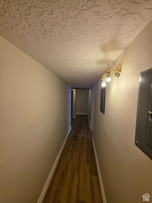 22 Snowstar Ln, Sandy, UT 84092 - hall featuring dark wood-type flooring, electric panel, baseboards, and a textured ceiling