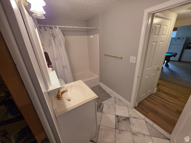 22 Snowstar Ln, Sandy, UT 84092 - full bathroom with a textured ceiling, vanity, marble look tile flooring, shower / bath combination with curtain, and baseboards