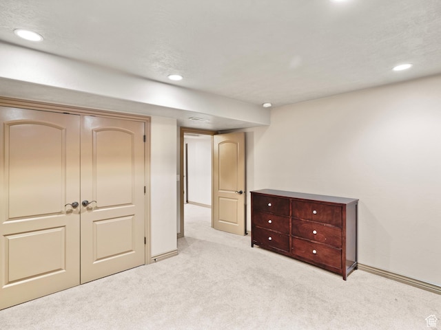 unfurnished bedroom with carpet flooring, recessed lighting, baseboards, and a closet