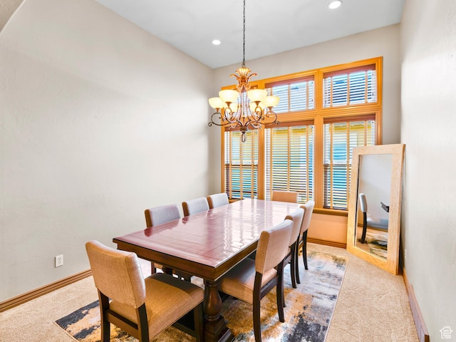 dining room with light colored carpet, a chandelier, baseboards, and recessed lighting