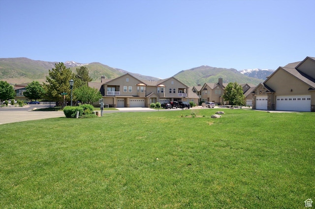 992 N Shetland Ln W, Farmington, UT 84025 - view of front of home featuring a mountain view, a residential view, a front yard, and a garage