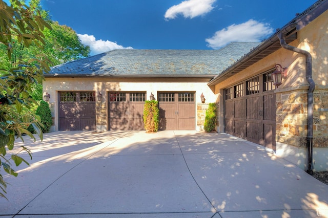 garage with concrete driveway