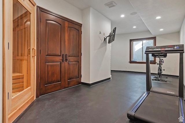 workout room featuring baseboards and recessed lighting