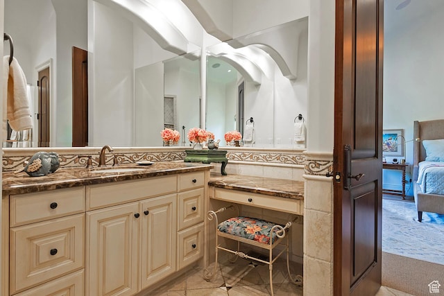 ensuite bathroom featuring vanity