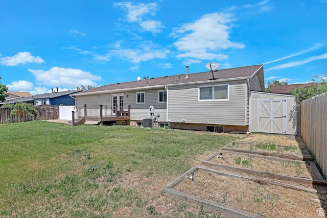 621 W 920 N, Orem, UT 84057 - rear view of house featuring a vegetable garden, a shed, a wooden deck, an outdoor structure, and central AC