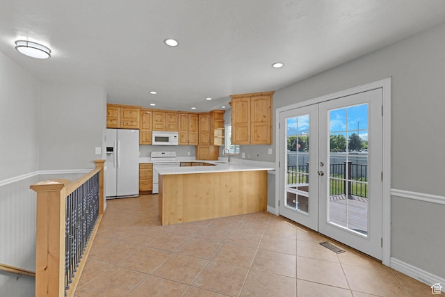 621 W 920 N, Orem, UT 84057 - kitchen featuring white appliances, french doors, a peninsula, light countertops, and recessed lighting