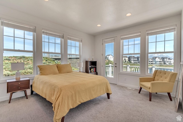 bedroom with access to outside, baseboards, light carpet, and recessed lighting
